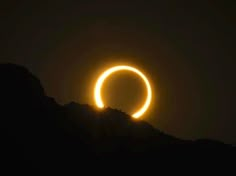 the sun eclipse is seen in this photo taken on march 22, 2013 over mountains