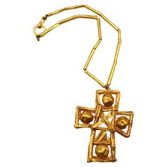 CHRISTIAN LACROIX vintage massive textured gold tone openwork cross pendant necklace. The cross can be used as a brooch or a pendant. Gold toned chain (unmarked). Hook clasp closure. Marked on the reverse of the cross CHRISTIAN LACROIX CL Made in France. Chain is unmarked. Indicative measurements : chain length approx. 44.5 cm (17.52 cm) / cross approx. 8.8 cm (3.46 inches) x 7 cm (2.76 inches). Comes with a CHRISTIAN LACROIX dust bag (used vintage condition). Material : Gold tone metal hardware Luxury Collectible Cross Pendant Jewelry, Vintage Cross Necklace Collectible, Christian Lacroix Jewelry, Orthodox Cross Pendant, Christian Lacroix Jewelry Vintage, Collectible Cross-shaped Jewelry With Large Pendant, Christian Lacroix, Cross Pendant Necklace, Vintage Jewels