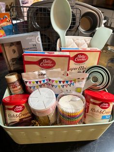 a basket filled with baking supplies on top of a counter