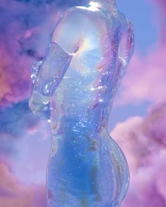 a woman's body is covered in water against a purple and blue sky with clouds