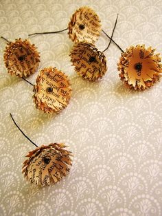 four pieces of wood are arranged in the shape of sunflowers on a white surface