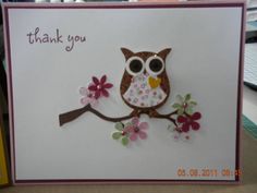 an owl is sitting on a branch with flowers in its beak, and the words thank you are written above it