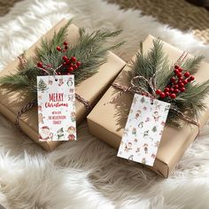 two wrapped presents sitting on top of a white blanket