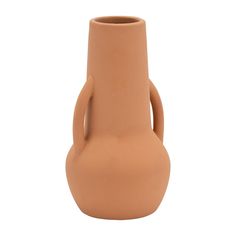 a brown vase is sitting on a white surface and it has a curved handle in the shape of a hand