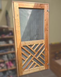 an open wooden door in front of shelves