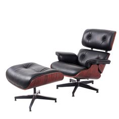 an eames lounge chair and ottoman in black leather