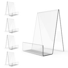 four clear acrylic displays are lined up against each other on a white background