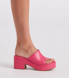 Give off fabulous vibes in these of-the-moment platform mules! They feature an open almond-shaped toe. a wide banded toe strap. an open back for easy on-and-off styling. a platform sole. and a thick block heel. Pair with a quilted handbag.Fit & Features Open almond-shaped toe Wide banded toe strap Open back Platform sole Thick block heel Faux leather material. subtle cushioned insole Runs true to size Spring Platform Slippers With Heel Loop And Round Toe, Trendy Summer Platform Slippers With Heel Loop, Chic Summer Platform Slippers With Chunky Platform, Trendy Mules With Wedge Heel And Heel Loop, Summer Chunky Platform Open Heel Mules, Trendy Chunky Platform Slide Sandals, Spring Chunky Platform Synthetic Mules, Chic Platform Slide Slippers, Chic Platform Slippers For Summer