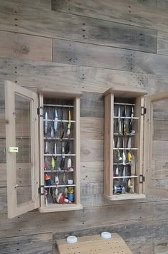 two wooden shelves with different types of items in them on the side of a wall