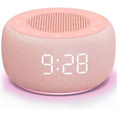 the alarm clock is pink and has white numbers