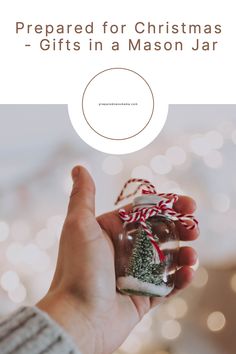 a person holding a jar with a christmas tree in it and the words preparing for christmas - gifts in a mason jar