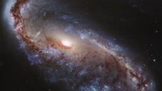 an image of a spiral galaxy in the night sky