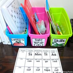 several bins with different types of letters and numbers in them sitting on a table