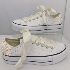 Converse Platforms embellished with : - Fully embellished backstrips with Champagne and Rose Gold Pearls and Gold and Clear Swarovski crystals - Pearls and Swarovski crystals embellished on the outsides of the shoes in a spray gradual fade effect - Finished with Beautiful full Ivory satin laces Embellished Low-top Wedding Sneakers, Embellished Lace-up Sneakers For Weddings, Champagne And Rose Gold, Outfit With Pearls, Bedazzled Converse, Wedding Sneakers For Bride, Converse Platforms, Converse Wedding, Converse Wedding Shoes