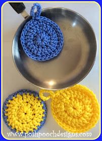 two crocheted dishcloths sitting on top of a frying pan next to each other