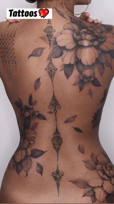 the back of a woman with tattoos on her body