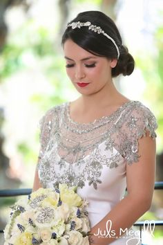 a woman in a wedding dress holding a bouquet