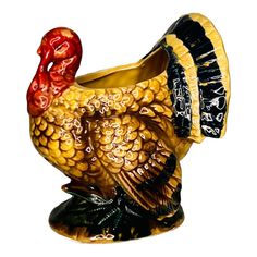 a ceramic turkey is shown on a white background