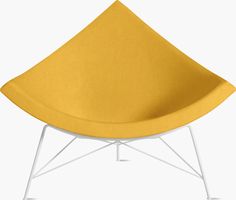 a yellow chair sitting on top of a white base