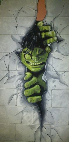 the incredible hulk painting is being displayed in this bathroom wall art piece, which features green hands and an open mouth