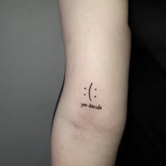 a woman's arm with a tattoo saying you decide