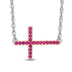 A sleek choice, this cross necklace expresses your beliefs in modern style. Crafted in sterling silver, this design features a cross set on its side and lined with lab-created bright red rubies. Buffed to a brilliant luster, this look suspends centered along an 18.0-inch rope chain that secures with a spring-ring clasp. Sideways Cross Necklace, Cross Necklace Sideways, Sterling Silver Cross Necklace, July Birthday, Peoples Jewellers, Cross Ring, Ruby Stone, Red Stone, White Metal