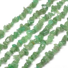 the beads are green and have many different shapes