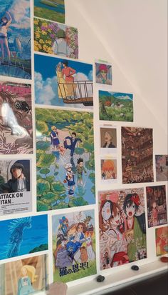 there are many anime pictures on the wall