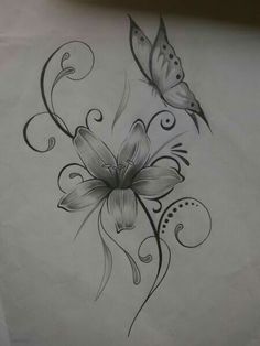 a drawing of flowers and butterflies on a piece of paper with ink drawn in it