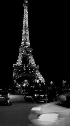 black and white photograph of the eiffel tower at night