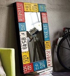 a colorful mirror sitting on top of a wooden shelf