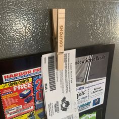 some coupons are hanging on the wall