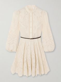 Zimmermann's 'Ottie' dress is detailed with ornate embroidery, which only adds to its whimsical feel. Cut from breathable linen and trimmed with ramie, it's framed with a stand collar and billowing blouson sleeves, falling to a swishy mini skirt with a pretty scalloped hem. Use the braided leather belt to cinch the waist. Chic Embroidered Dress For Formal Occasions, Chic Embroidered Formal Dresses, Elegant Cream Embroidered Dress With Floral Details, Elegant Embroidered Silk Dresses, Elegant Silk Embroidered Formal Dress, Chic Embroidered Fitted Dress For Formal Occasions, Chic Fitted Embroidered Dress For Formal Occasions, Chic Embroidered Mini Dress For Wedding, Chic Fitted Embroidered Formal Dress