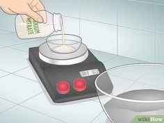 a person is pouring something into a bowl on top of a scale in the bathroom