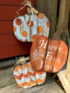 wooden pumpkins with happy fall written on them