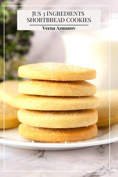 a stack of shortbread cookies sitting on top of a white plate