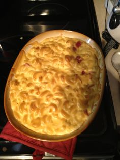 macaroni and cheese casserole in a pan on the stove