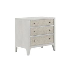 a white dresser with three drawers on it