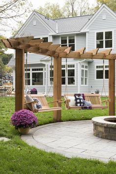 a wooden bench sitting next to a fire pit