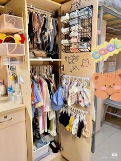 the closet is full of baby clothes and other things to put on it's shelves