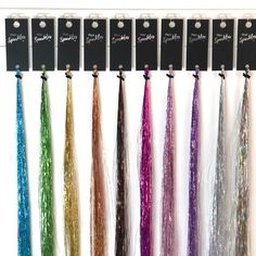 If you are looking to add Hair Sparkles® as a service at your salon, our professional system offers the highest grade strands you will find. We offer a range of 34 stunning colours and our Sparkles are lightweight, 40 inches long, heat- and colour-resistant (except the Pearl variety which cannot be heat-styled). We have designed a hanging tag to help keep your strands organised and tidy. Our exclusive display solution is designed to look neat, attractive and professional; the crystal clear hangi Hair Sparkles, Amber Hair, Hair Extension Shop, Diamond Hair, Hair Tinsel, Fairy Hair, Salon Hair, Rose Gold Hair, Popular Color