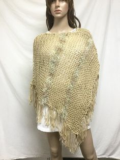 Knit Poncho,tan, w/ Woven in Gold, fringed poncho Casual One Size Poncho With Fringe, Casual One-size Poncho With Fringe, Spring Poncho With Tassels, Spring Poncho With Tassels One Size, Spring Poncho One Size With Tassels, One Size Spring Poncho With Tassels, One Size Tassel Poncho For Spring, Spring Fringe Poncho One Size, Casual Festival Poncho With Fringe