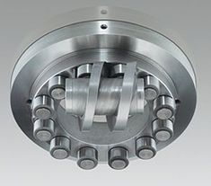 an image of the inside of a ball bearing unit with four screws on each side