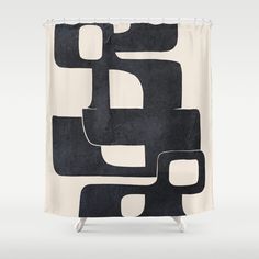 a black and white shower curtain with an abstract design on the front, featuring square shapes