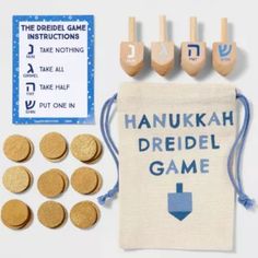 hanukkah dreidel game with wooden pegs and bag