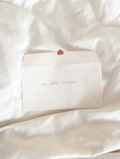 a piece of paper with the word san antonio written on it laying on a bed