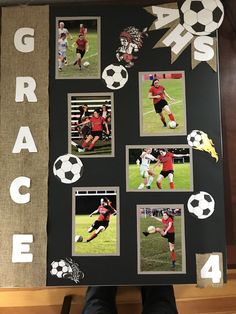 a group of people standing in front of a black board with pictures of soccer players on it