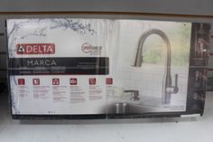 an advertisement for a new kitchen faucet is shown in the store's window