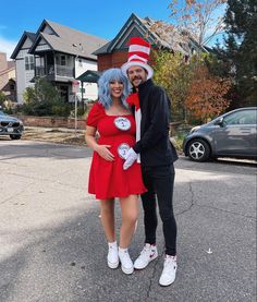 a man and woman dressed up as the cat in the hat