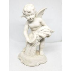 a statue of a little boy holding a bird